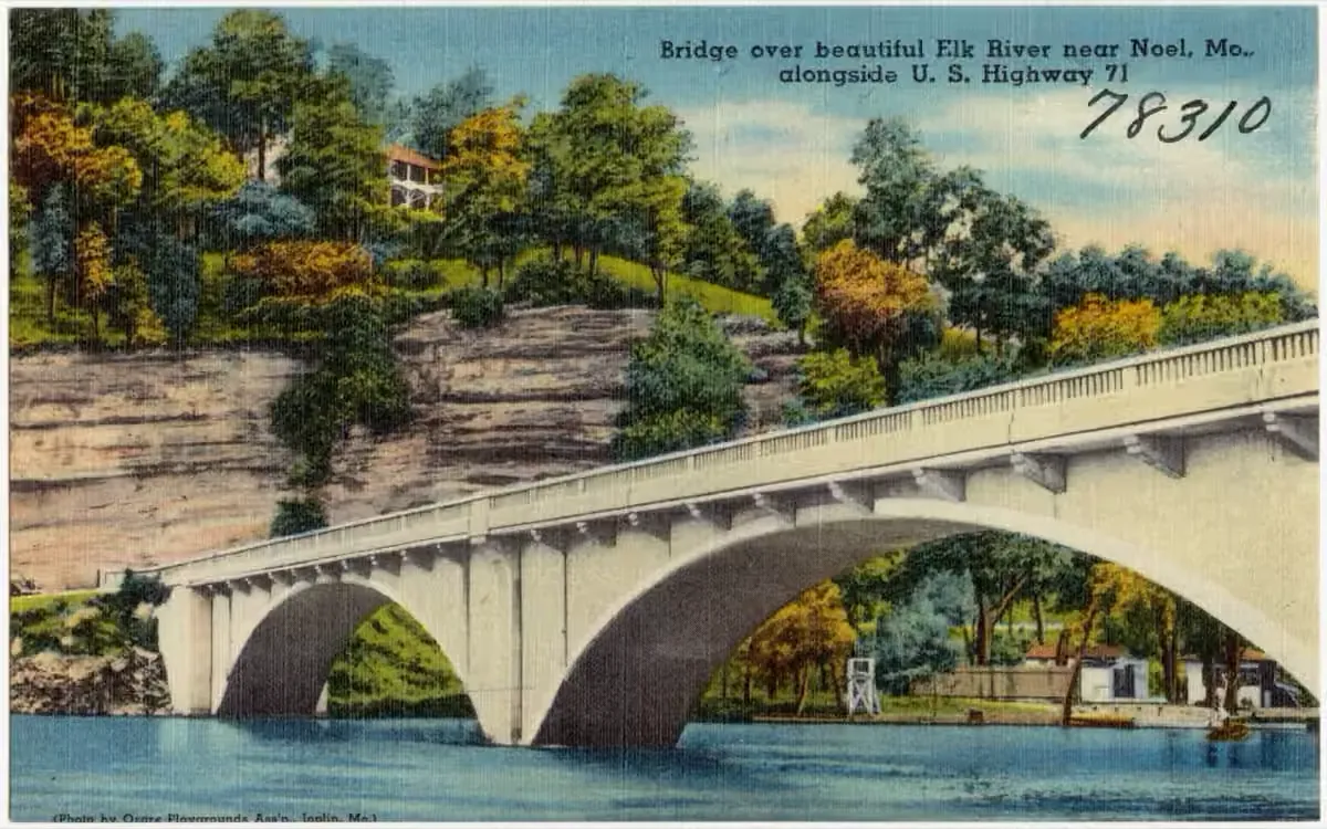 Historic linen postcard of a bridge over the Elk River near Noel, Missouri, alongside U.S. Highway 71, circa 1930–1945.